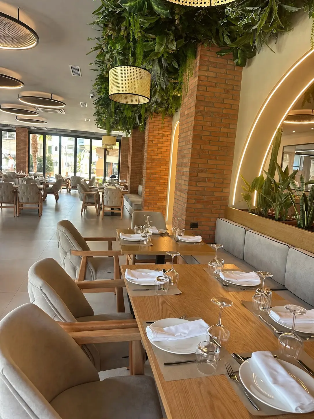 Set tables beneath Pescato's indoor garden