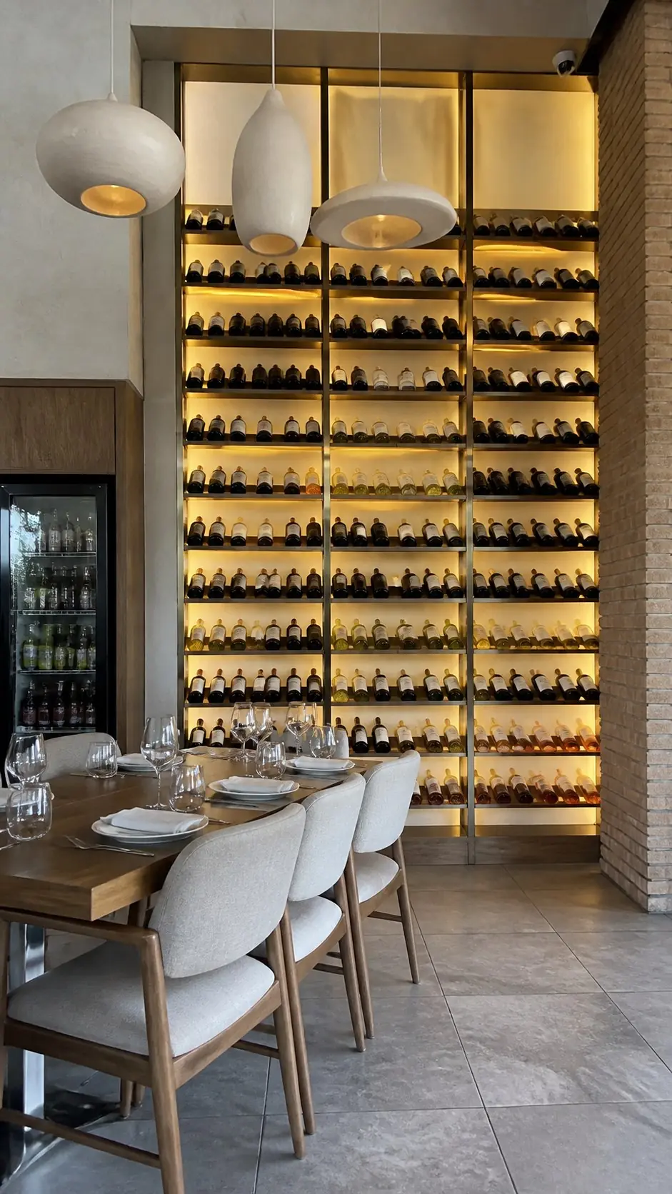 Pescato's illuminated wine wall and dining area
